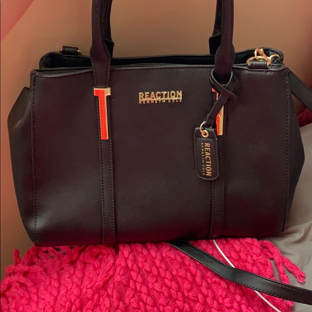 Black purse with gold accents